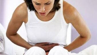 woman suffering from abdominal pain caused by parasites